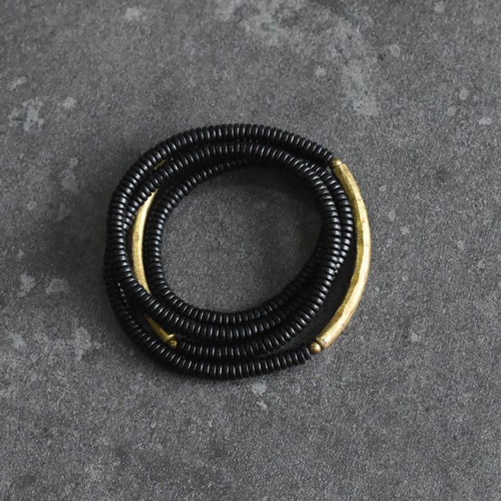 Bracelet multicouches en bois d'ébène et cuivre avec Buddha Stones