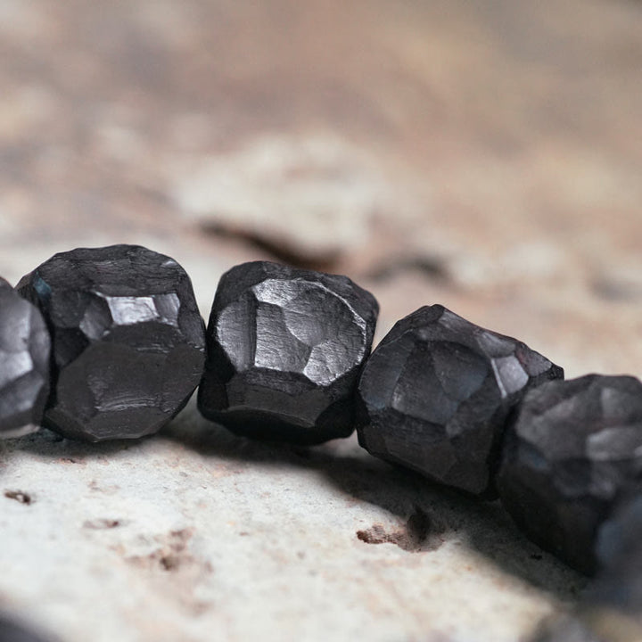Bracelet Mala en bois d'ébène et cuivre avec Buddha Stones et pompon de paix