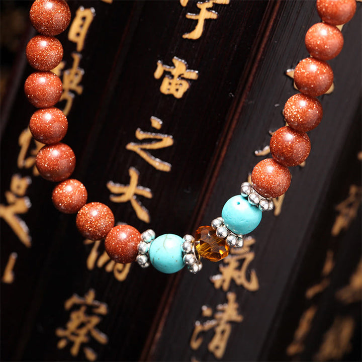 Bracelet de confiance avec 108 perles Mala en Buddha Stones Goldstone Om Mani Padme Hum Swastika