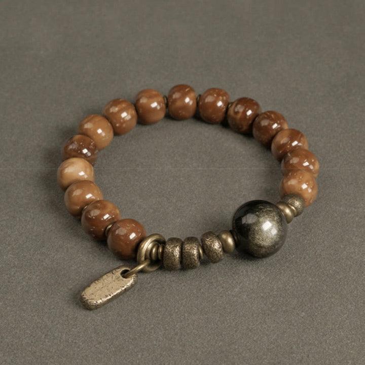 Bracelet porte-bonheur en cuivre et obsidienne dorée avec Buddha Stones de Kuka et œil de tigre