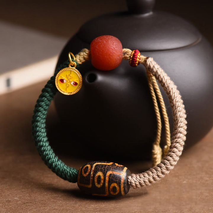 Bracelet en corde de richesse en perles tibétaines à neuf yeux Dzi fait main par Buddha Stones