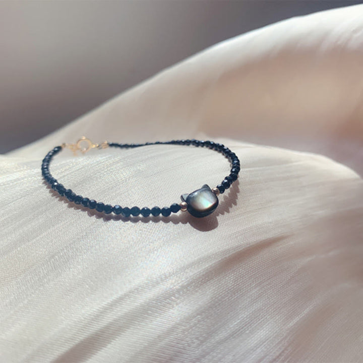 Bracelet de guérison en pierre tridacna avec spinelle noire et cristal blanc plaqué or 14 carats de Buddha Stones - image 9