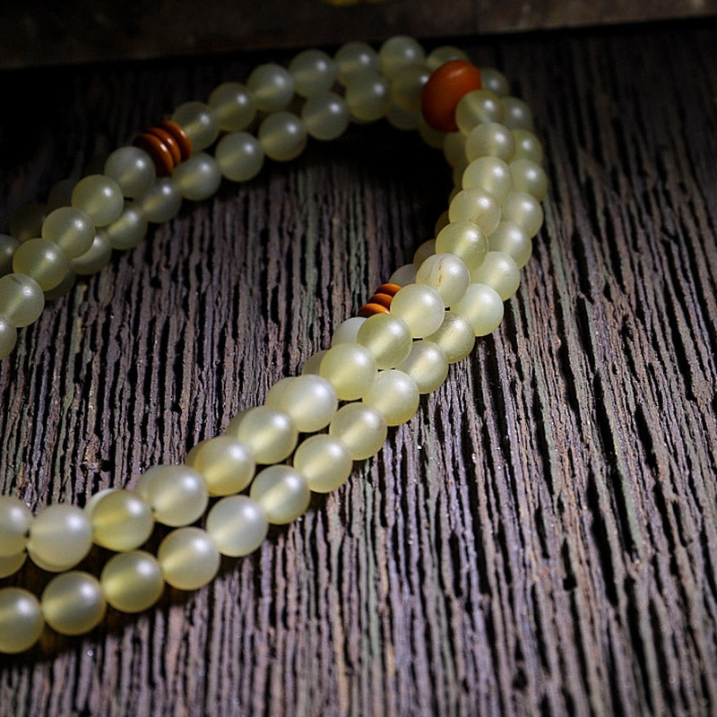 Bracelet porte-bonheur en ambre avec 108 Buddha Stones de Mala en corne de mouton du Tibet