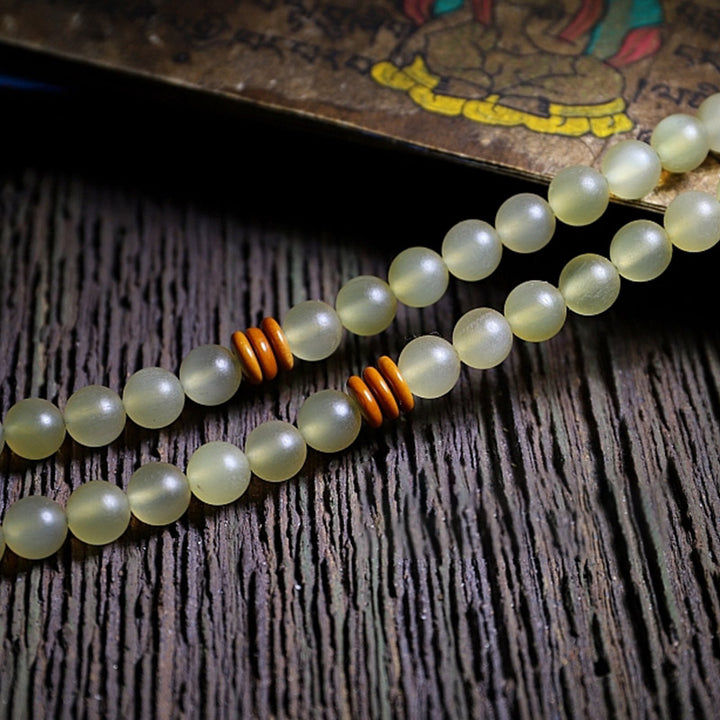 Bracelet porte-bonheur en ambre avec 108 Buddha Stones de Mala en corne de mouton du Tibet