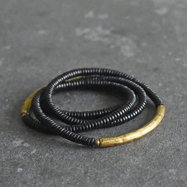 Bracelet multicouches en bois d'ébène et cuivre avec Buddha Stones