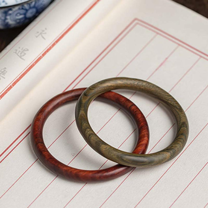 Bracelet de protection tibétain en petites feuilles de bois de santal rouge et ébène avec Buddha Stones
