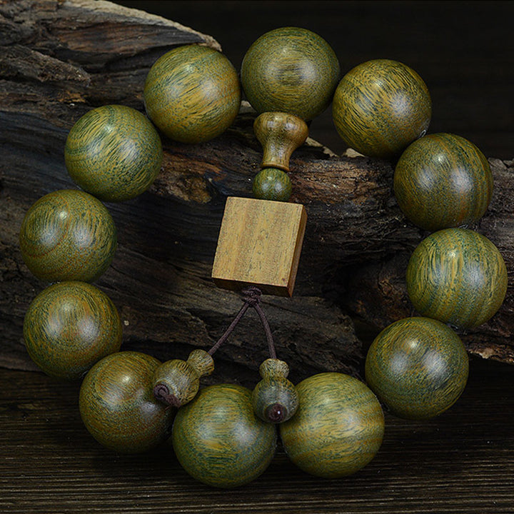 Bracelet de guérison tibétain en bois de santal vert Buddha Stones - 20 mm (12 perles) - image 0