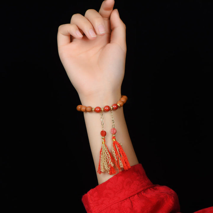 Bracelet Buddha Stones en bois de pêche et cinabre naturel avec pompons de richesse PiXiu