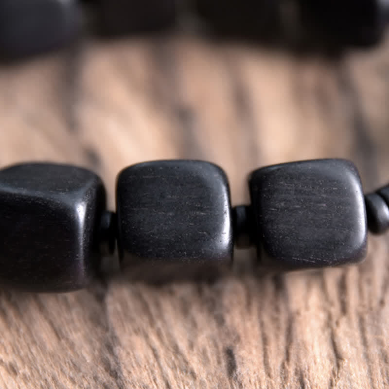 Bracelet de force en perles dzi en bois d'ébène tibétain avec Buddha Stones