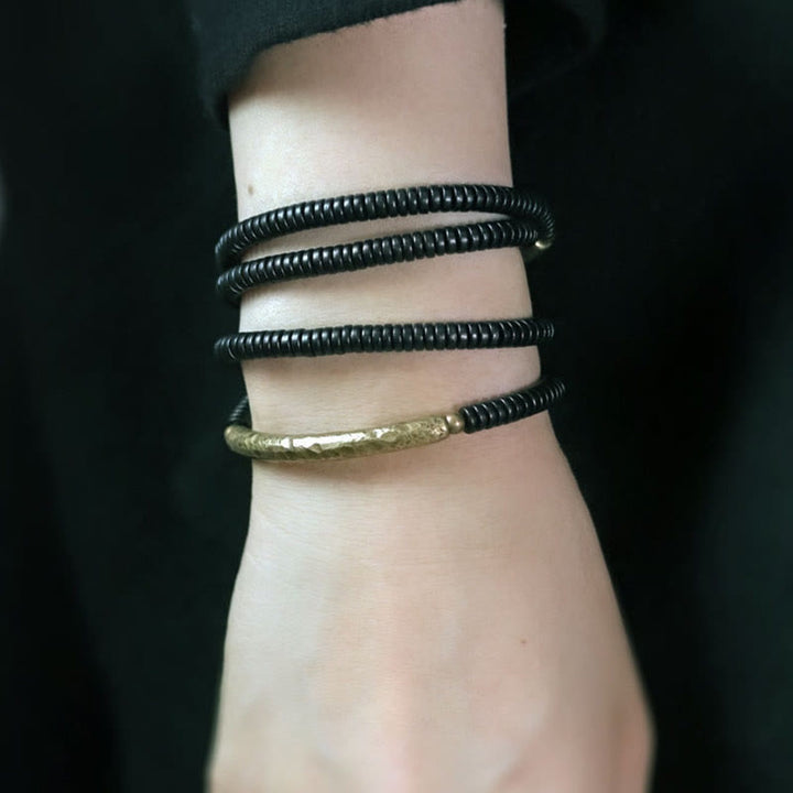 Bracelet multicouches en bois d'ébène et cuivre avec Buddha Stones