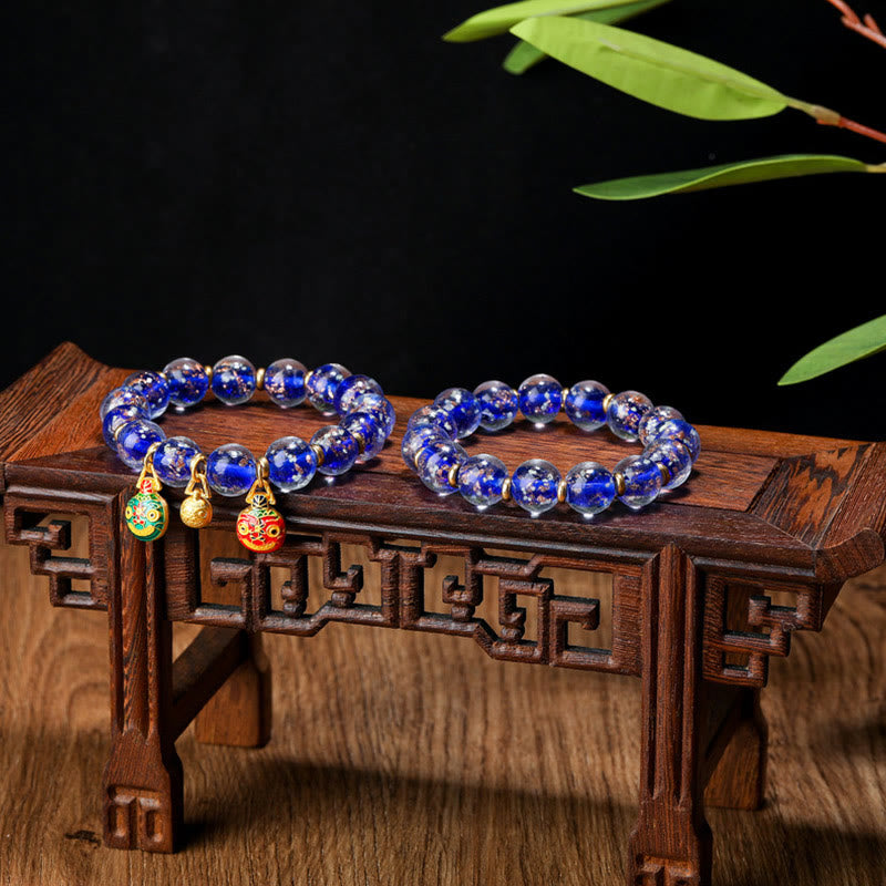Bracelet de réussite en perles de verre Liuli fluorescentes lumineuses avec breloque de famille de bêtes avaleuses en or et Buddha Stones