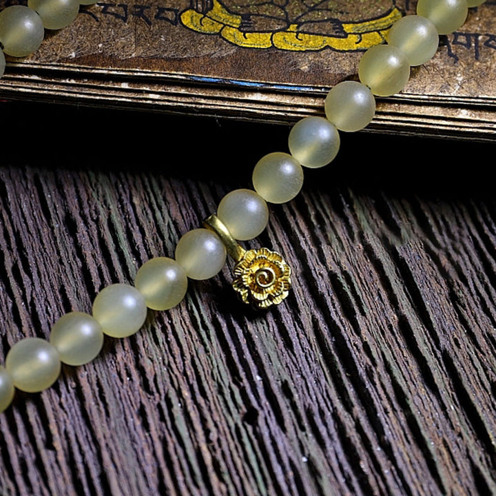 Bracelet porte-bonheur en ambre avec 108 Buddha Stones de Mala en corne de mouton du Tibet