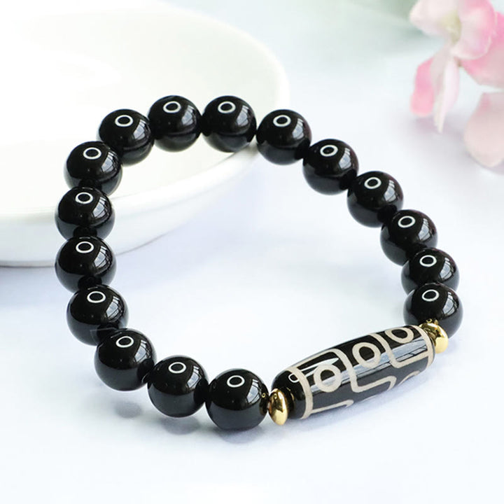 Bracelet de puissance tibétain en onyx noir avec perles dzi à neuf yeux et Buddha Stones