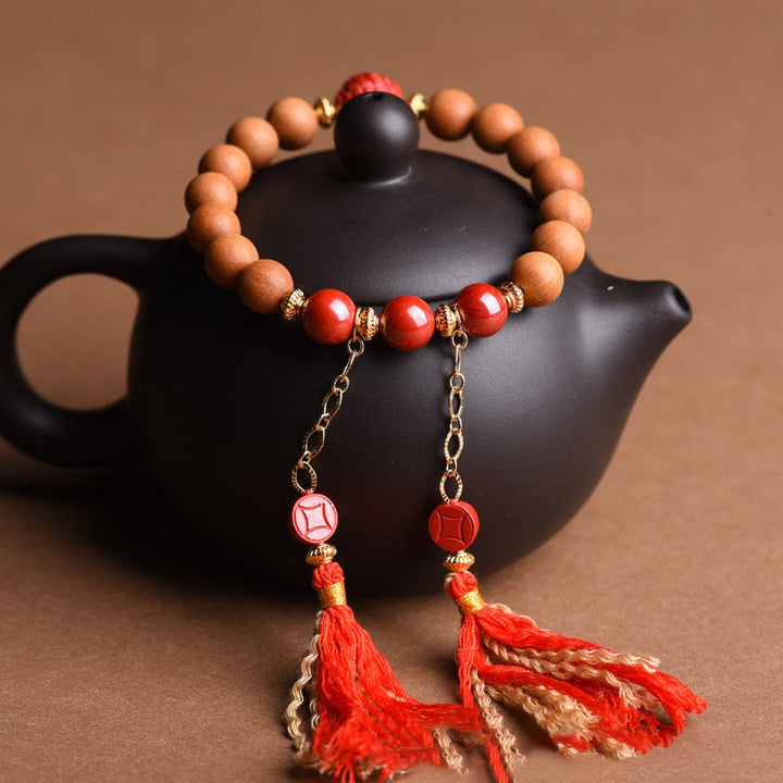 Bracelet Buddha Stones en bois de pêche et cinabre naturel avec pompons de richesse PiXiu