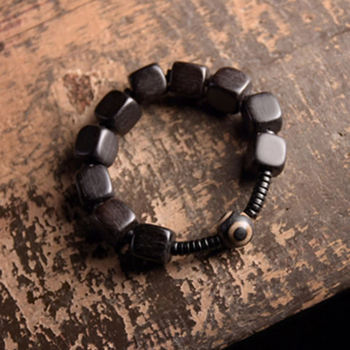 Bracelet de force en perles dzi en bois d'ébène tibétain avec Buddha Stones