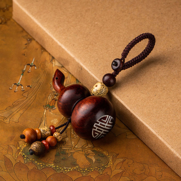 Porte-clés porte-bonheur en ébène tibétain à petites feuilles de gourde en bois de santal rouge
