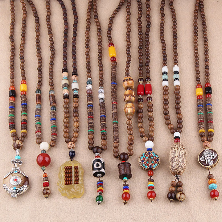 Collier pendentif protection éléphant en Buddha Stones tibétain en bois de wengé Bodhi Seed Agate