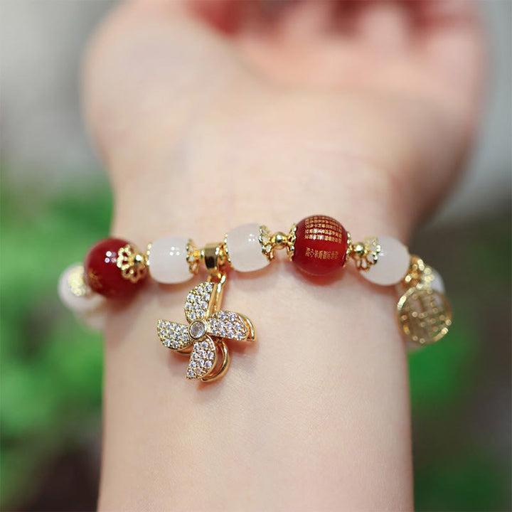 Bracelet de bénédiction avec breloque en forme de moulin à vent en Buddha Stones et caractère Fu