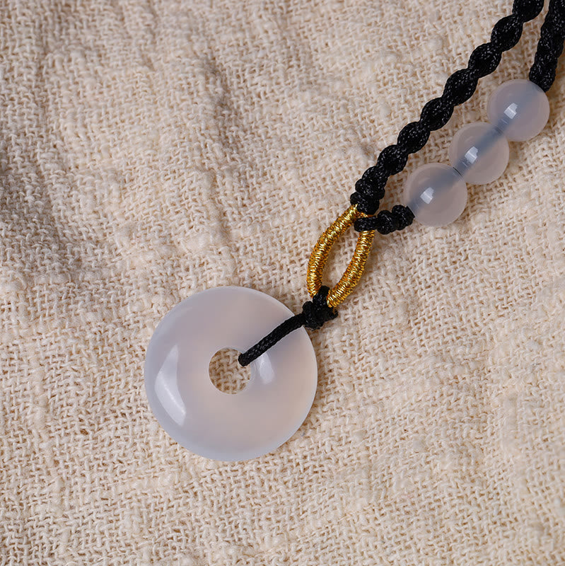 Collier pendentif de guérison avec boucle de paix en quartz fraise et calcédoine de Buddha Stones