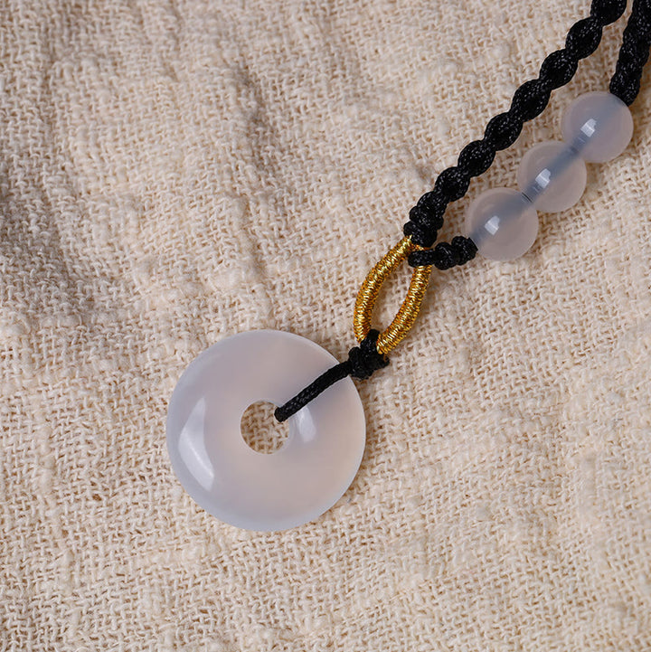 Collier pendentif de guérison avec boucle de paix en quartz fraise et calcédoine de Buddha Stones