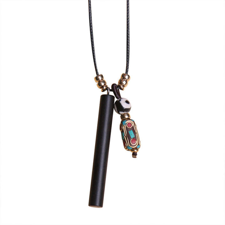 Collier pendentif en perles dzi en bois d'ébène tibétain avec symbole de paix et de calme