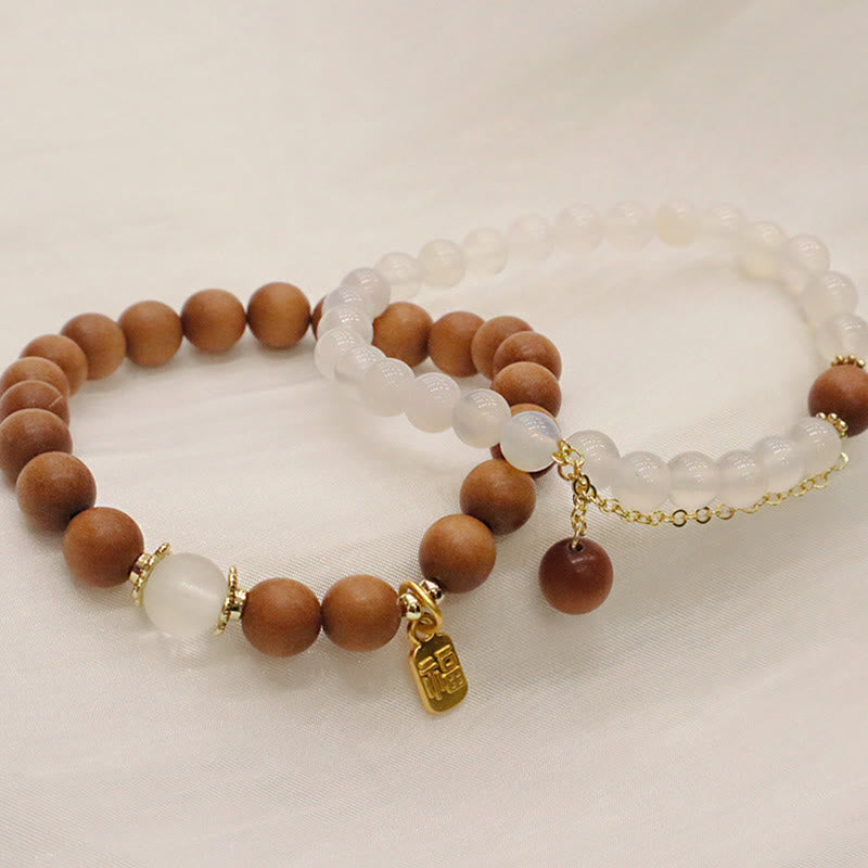 Bracelet de protection à breloques en bois de santal et œil de chat Fu avec Buddha Stones