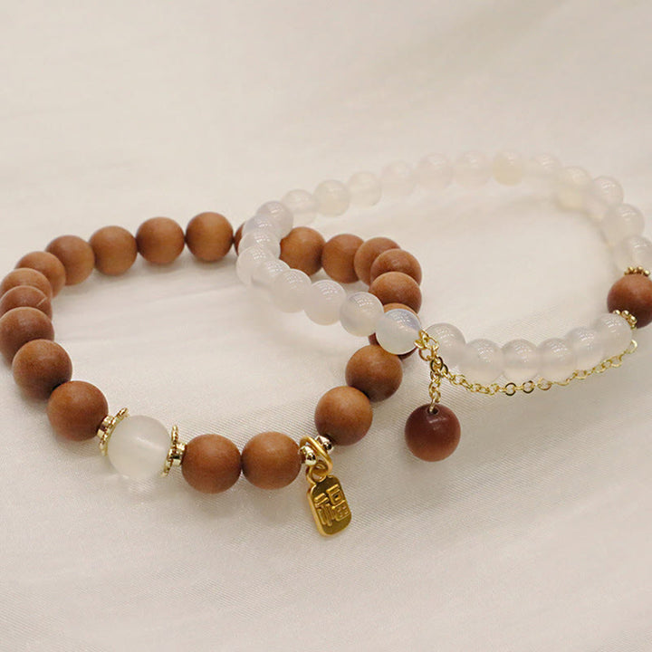 Bracelet de protection à breloques en bois de santal et œil de chat Fu avec Buddha Stones