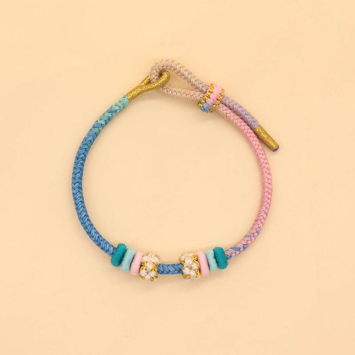 Bracelet tressé fait main en corde porte-bonheur avec nœud de paix à huit fils et nœud de fleur de pêcher en Buddha Stones - image 7