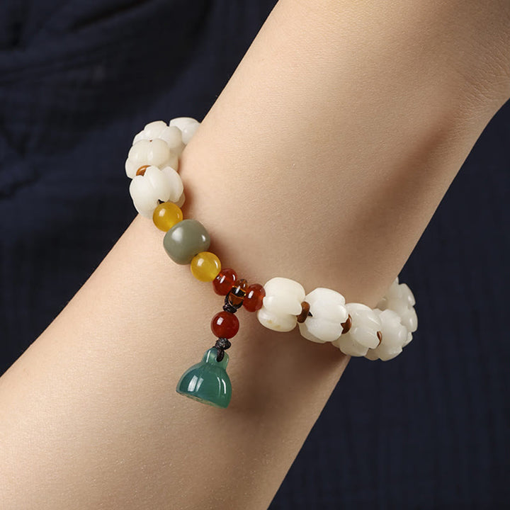 Bracelet en perles de citrouille gravées en agate rouge Bodhi Calme Harmonie Bodhi Graines naturelles Lotus