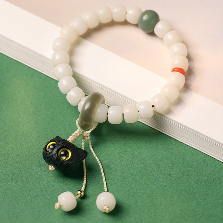 Bracelet en Buddha Stones en graines de Bodhi naturelles en bois noir africain avec joli chat et breloque pour la paix et l'harmonie - image 2