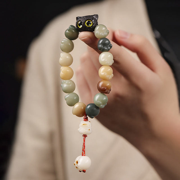 Bracelet de sagesse porte-bonheur en bois d'ébène avec de belles pattes et des graines de Bodhi naturelles de Buddha Stones - image 9