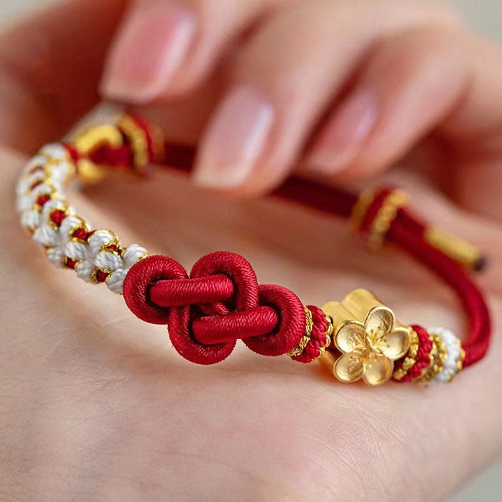 Bracelet porte-bonheur en corde avec breloque en fleur de pêcher et nœud d'amour véritable fait à la main par Buddha Stones