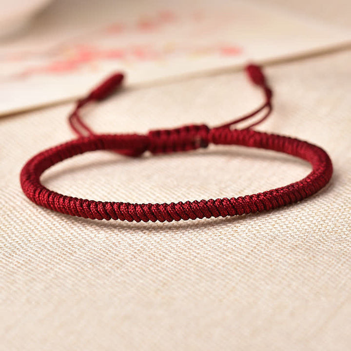 Bracelet tibétain porte-bonheur avec 3 Buddha Stones et cordon rouge
