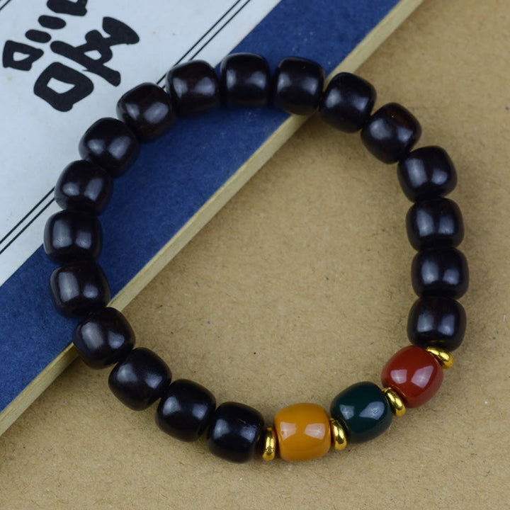 Bracelet de paix en bois de santal vert multicolore et bois d'ébène avec Buddha Stones et bois de santal rouge