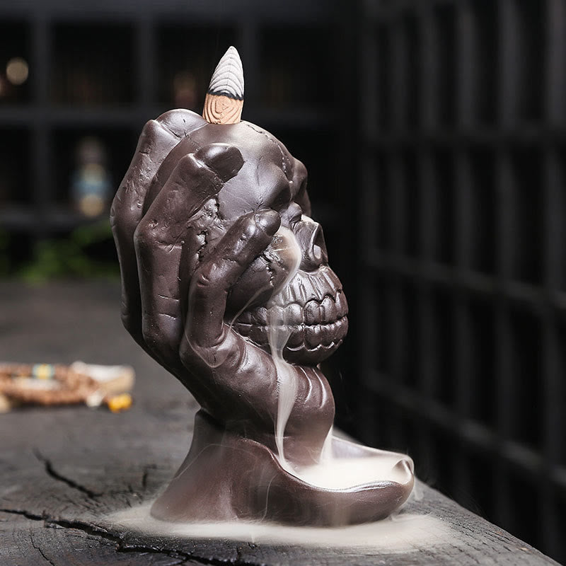 Brûleur d'encens spirituel en argile violette avec tête de mort et main fantôme en Buddha Stones