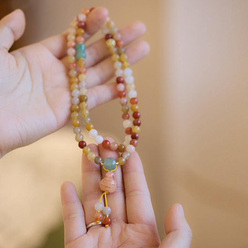 Bracelet triple tour en jade doré et soie naturelle avec breloque citrouille et Buddha Stones