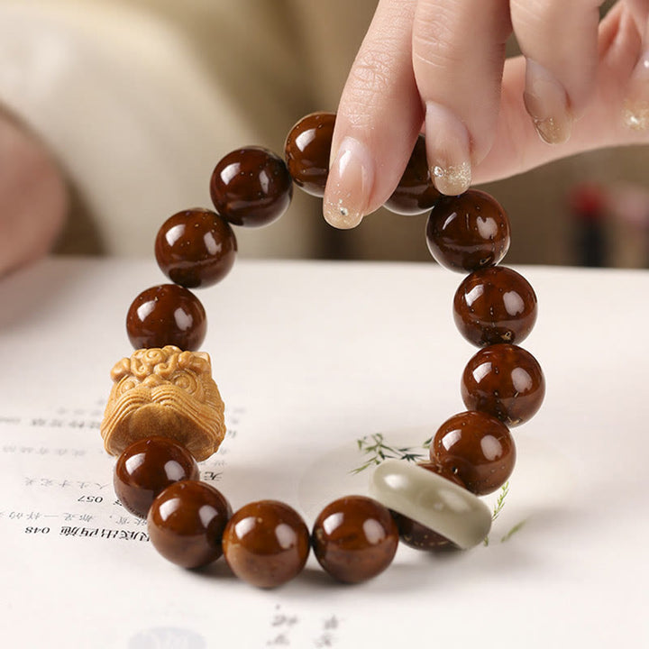 Bracelet de sagesse du lion dansant en Buddha Stones et graines de Bodhi violettes