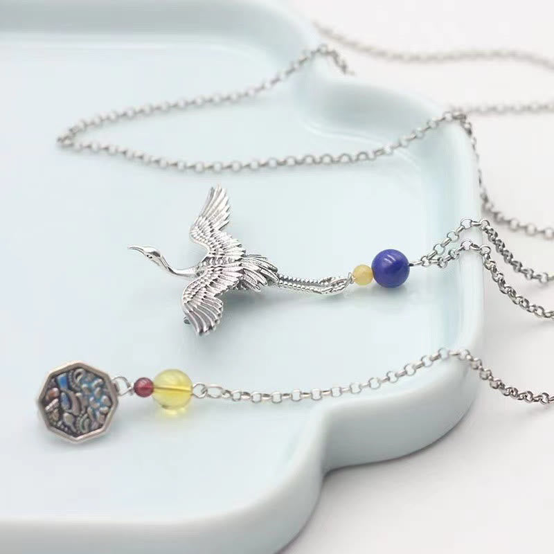 Broche en cuivre avec grue vintage et Buddha Stones