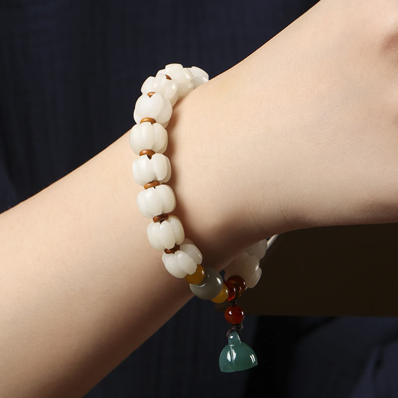 Bracelet en perles de citrouille gravées en agate rouge Bodhi Calme Harmonie Bodhi Graines naturelles Lotus