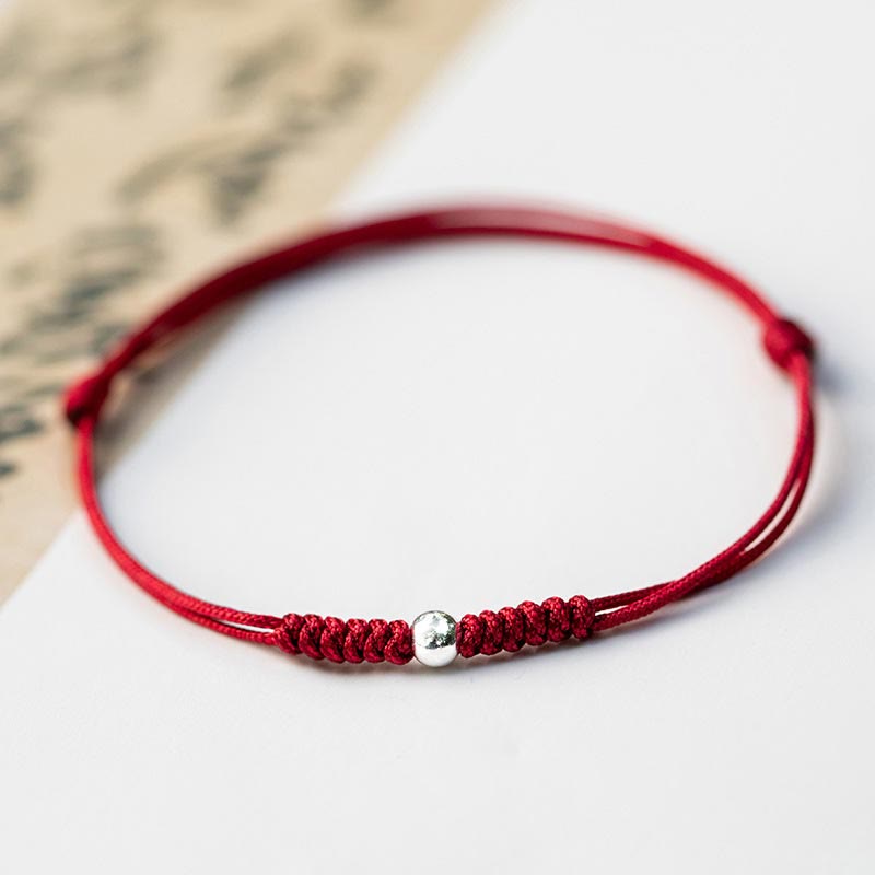 Bracelet en argent sterling 925 avec perle porte-bonheur et cordon fin tressé rouge, orné de Buddha Stones. - Perle ronde - Rouge foncé (tour de poignet 14-18 cm) - image 14
