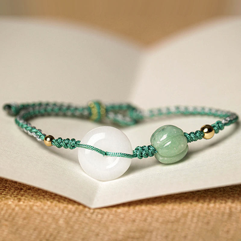 Bracelet tressé en jade blanc avec boucle de paix et perles citrouilles et Buddha Stones