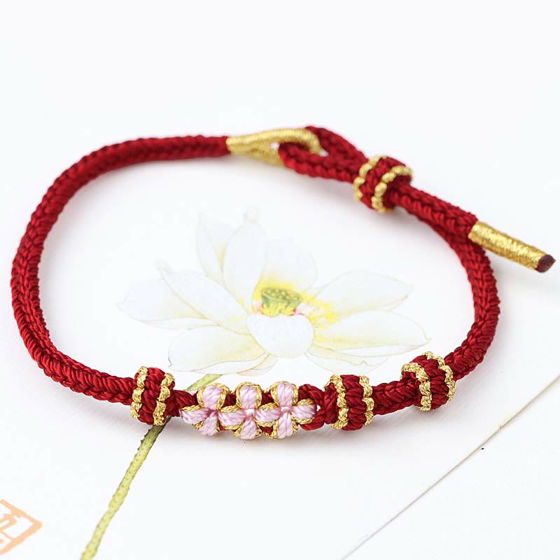 Bracelet tressé fait main à huit brins avec trois fleurs de pêcher et Buddha Stones