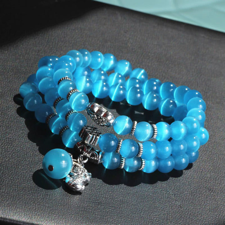 Bracelet triple tour de soutien PiXiu œil de chat en Buddha Stones