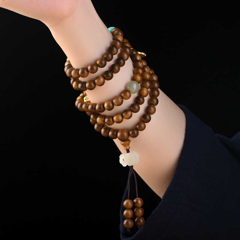 Bracelet Mala tibétain de protection et de calme en bois de rose avec Buddha Stones