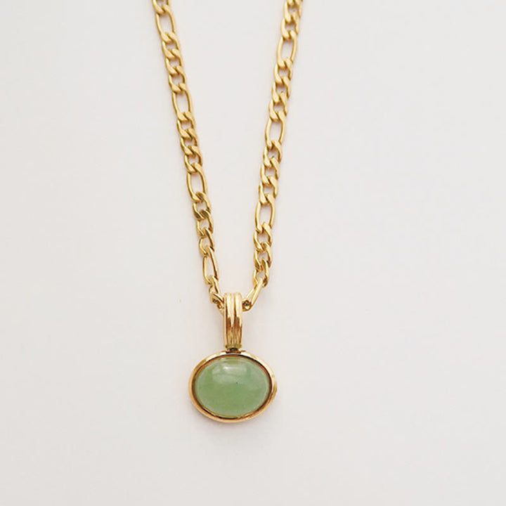 Collier pendentif ovale en acier titane et turquoise