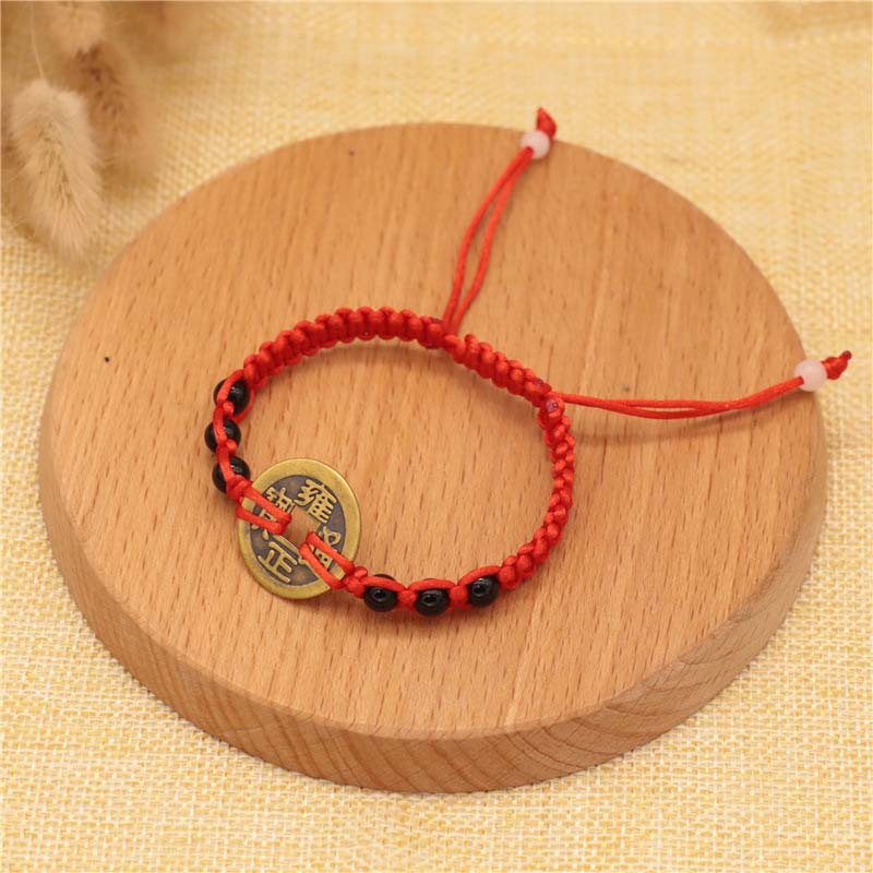 Bracelet tissé en fil rouge avec pièces de cuivre et Buddha Stones