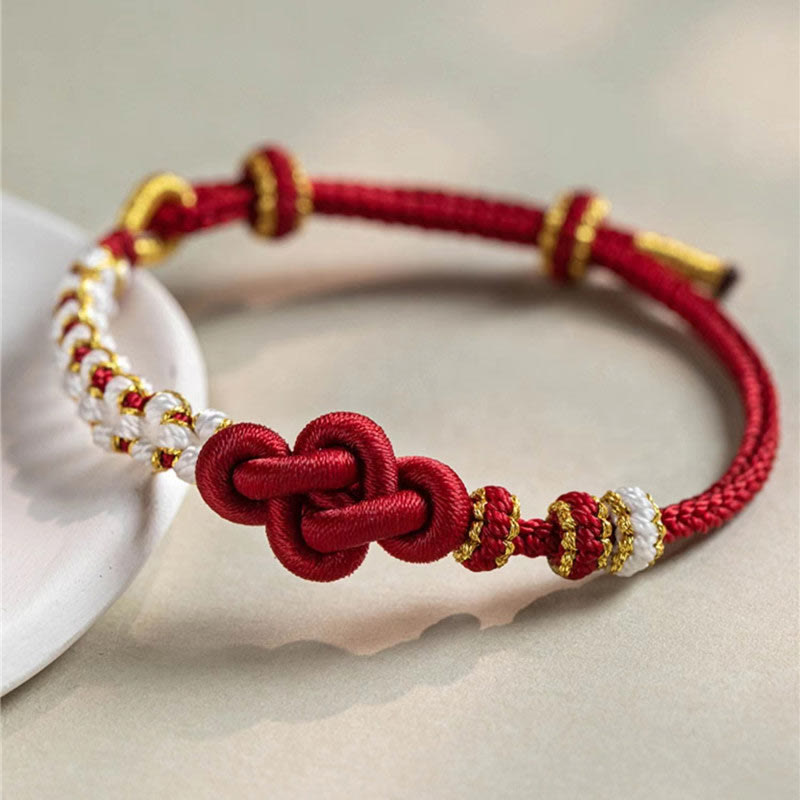 Bracelet porte-bonheur en corde avec breloque en fleur de pêcher et nœud d'amour véritable fait à la main par Buddha Stones