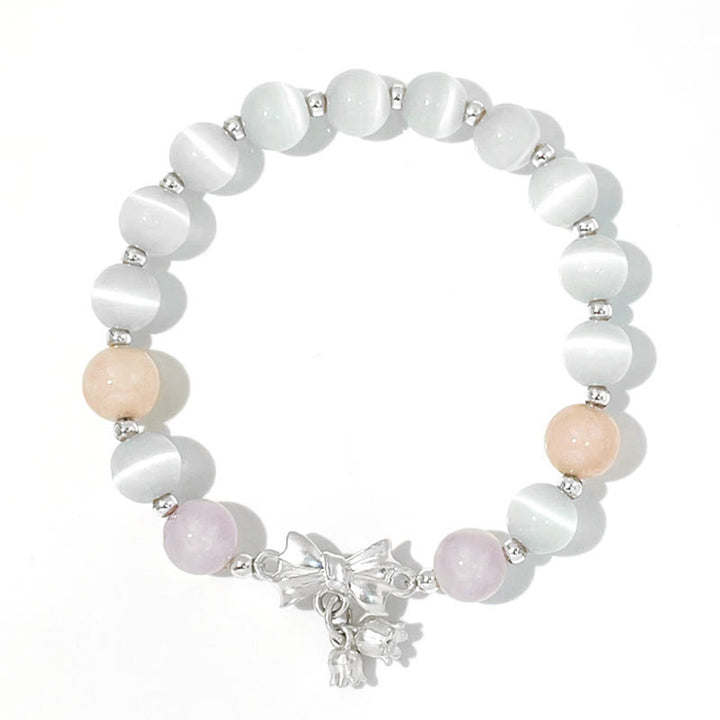Bracelet à breloques en forme de rosette avec œil de chat, lavande et améthyste de Buddha Stones
