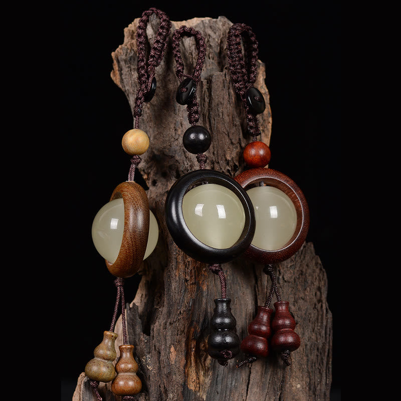 Porte-clés porte-bonheur lumineux en Buddha Stones en bois de santal rouge et bois d'ébène en bois de santal vert