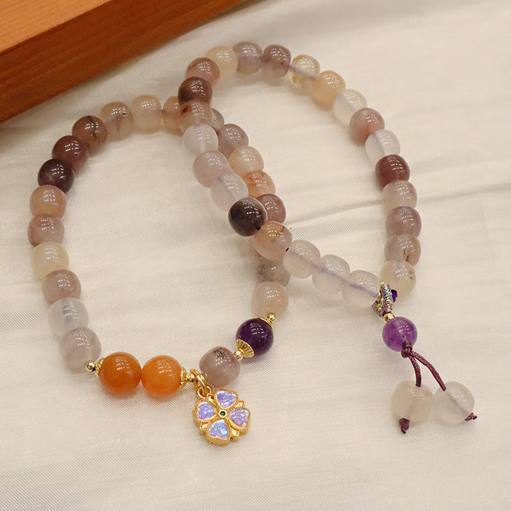Bracelet de richesse en perles de jade violet doré en Buddha Stones